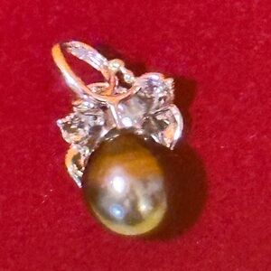 Mikimoto Silver and Black Pearl Brooch 
Sterling silver Black natural pearl